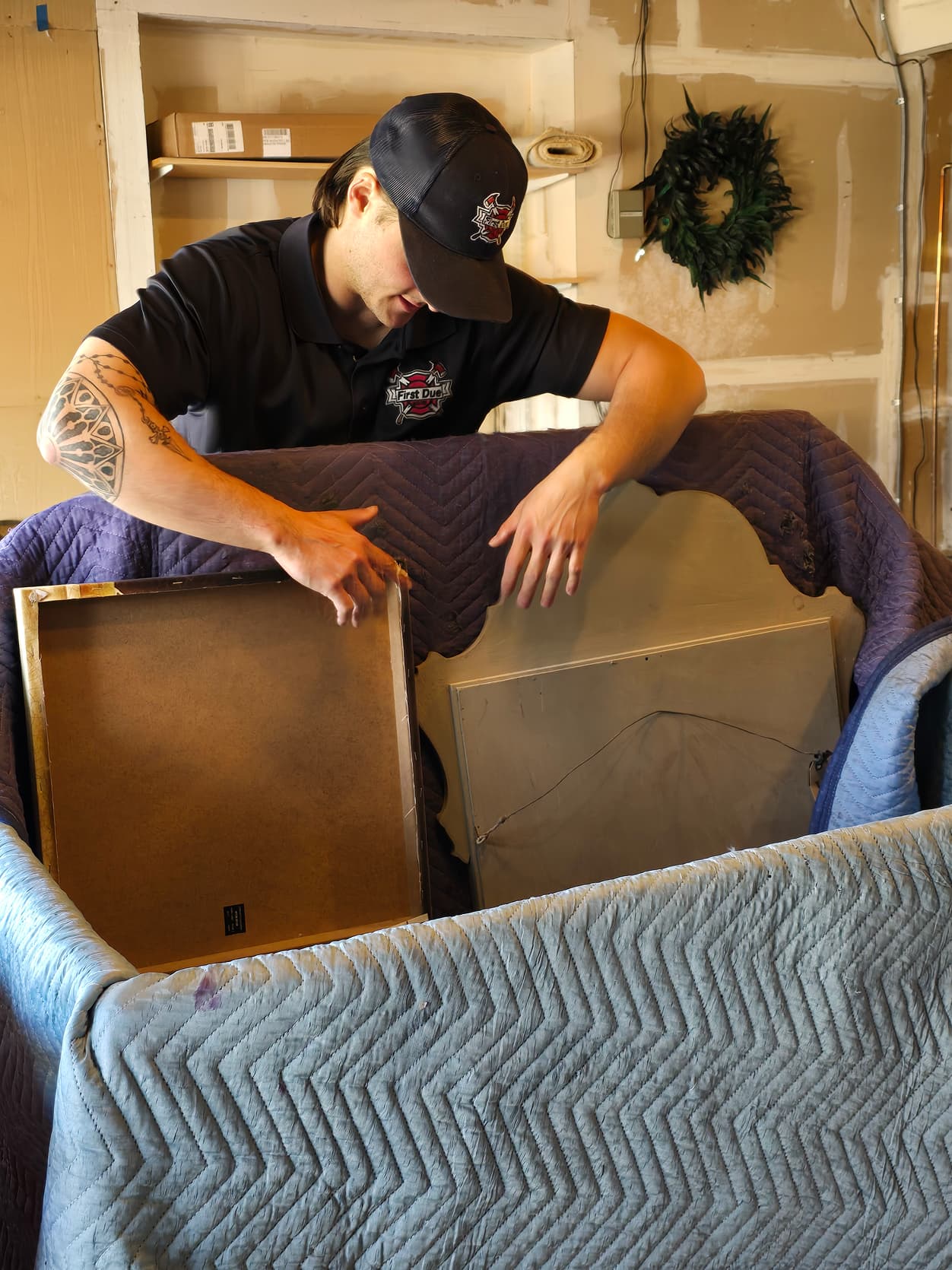 First Due Movers carefully wrapping furniture
